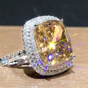 ring - silver with canary yellow stone. Size 7.